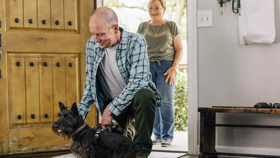 Shannon, a real GLASSIA patient, with his dog.